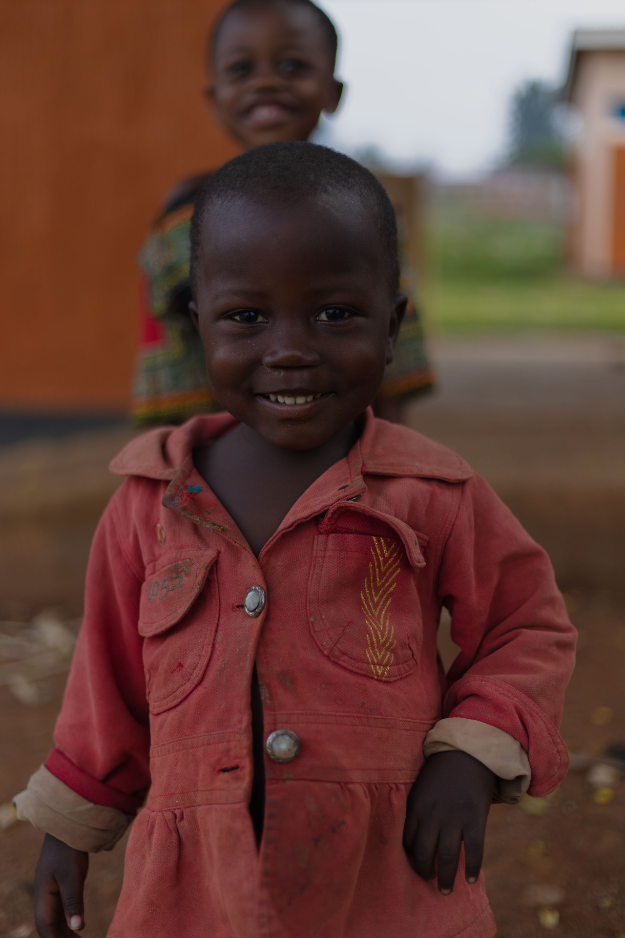 Smiling child representing hope and healing in refugee healthcare